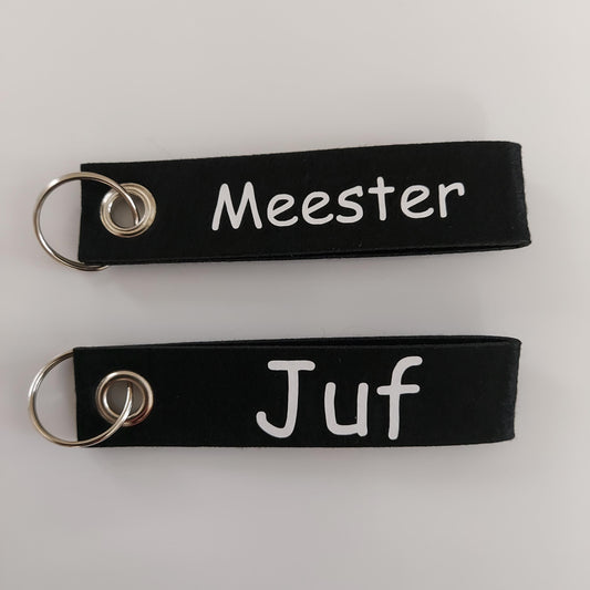 sleutelhanger voor een cadeautje voor de juf of meester van het blije snoetje.